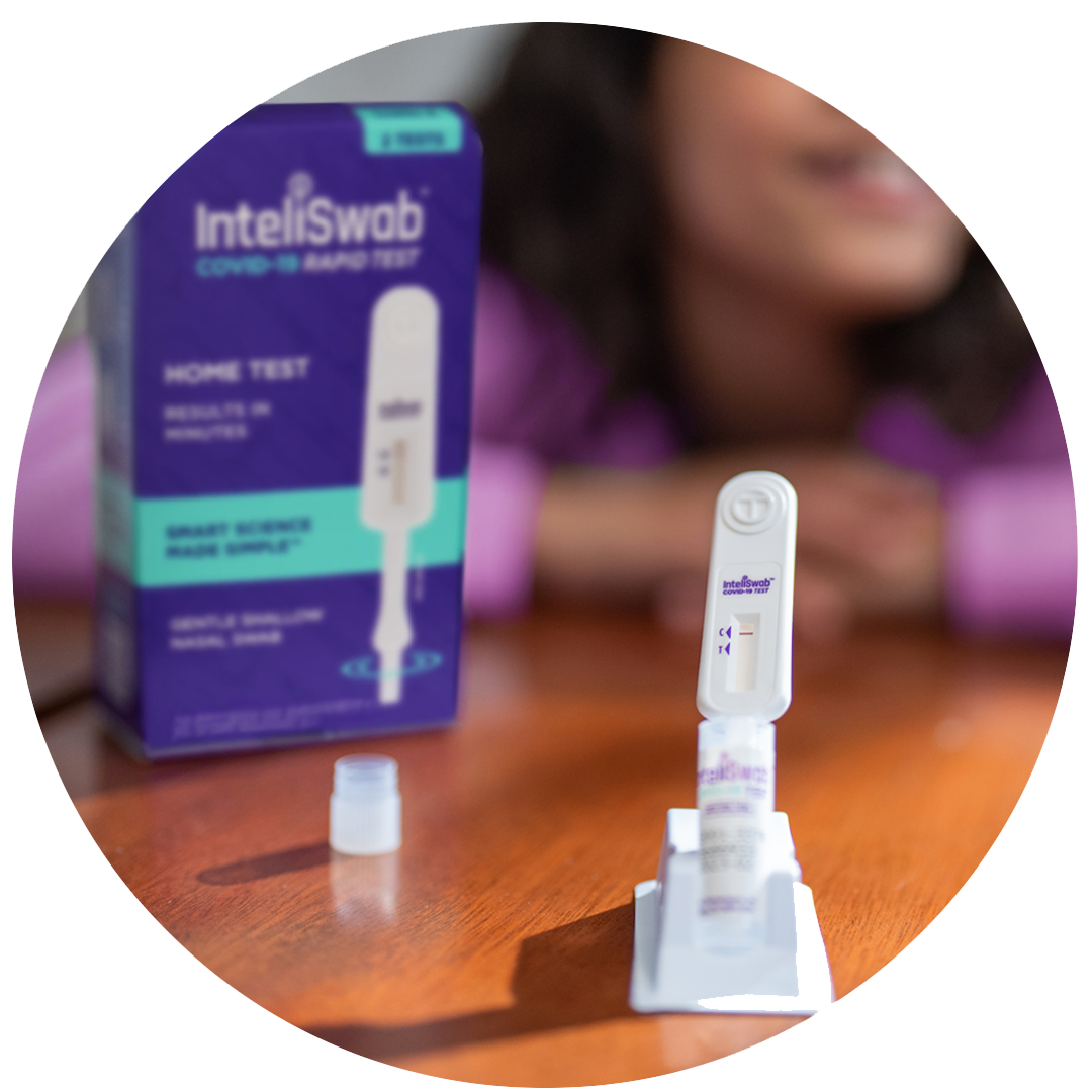 A swab is in a tube and the test result is displayed on the front.